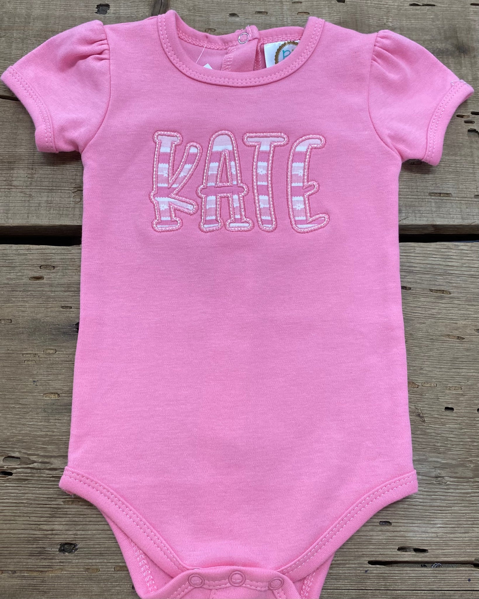 Appliqué Kate Onesie